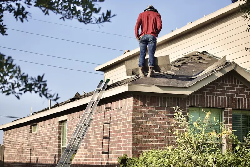 Professional roofer working on a residential roof in Universal City